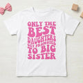 May include: White t-shirt with the text "ONLY THE BEST DAUGHTERS GET PROMOTED TO BIG SISTER" in pink, retro-style lettering. The shirt is a short-sleeved crew neck.
